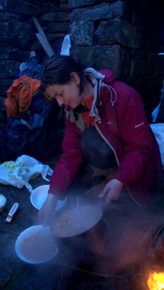 Anne prepares food in the Shieling